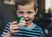 Kid playing with fake teeth